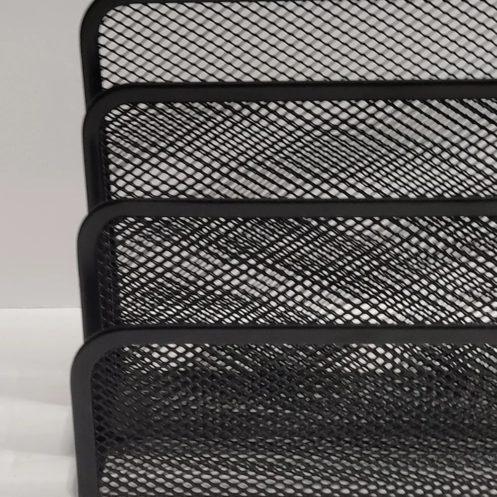 Black, three-tiered metal mesh file holder. 318